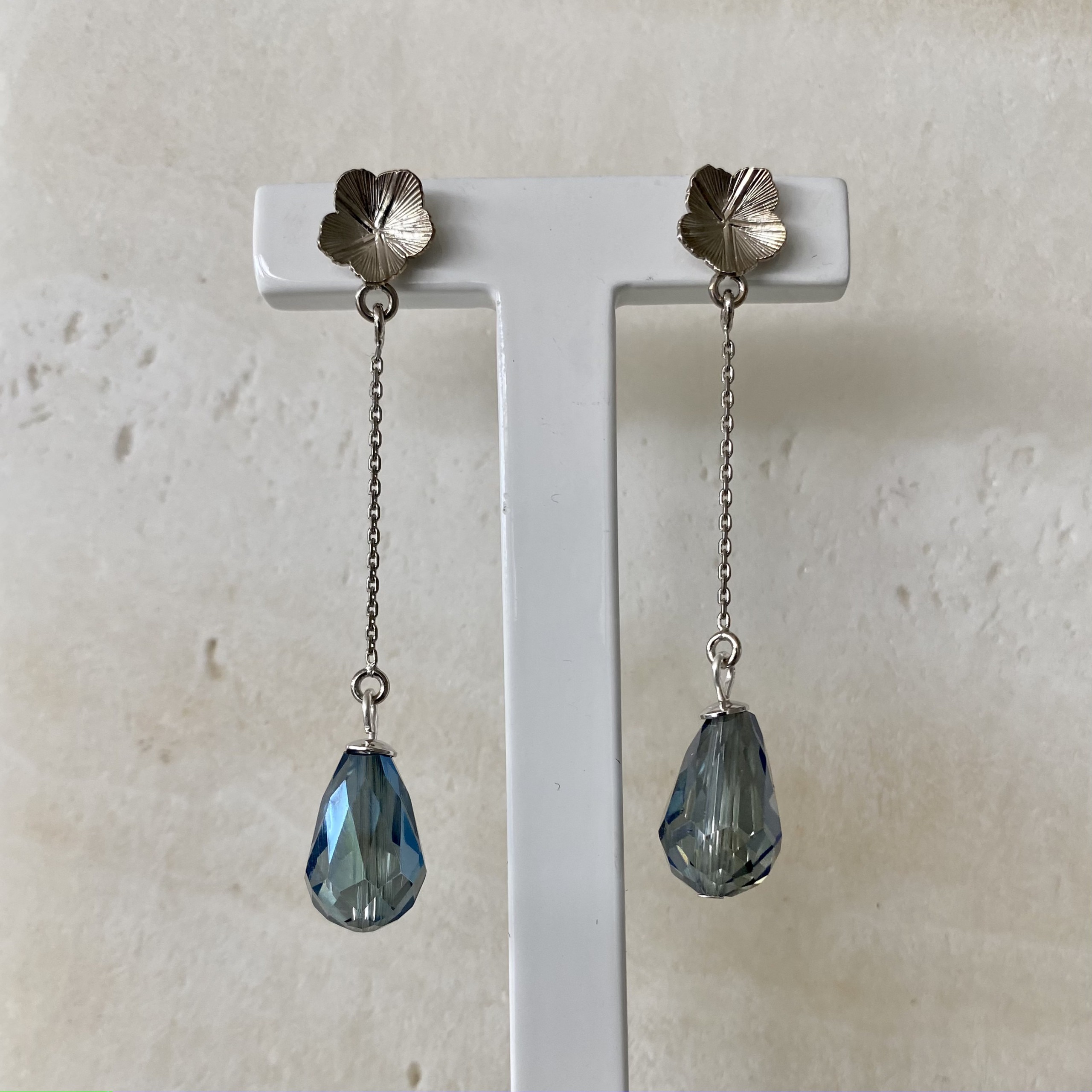 Silver petal long blue drop earrings